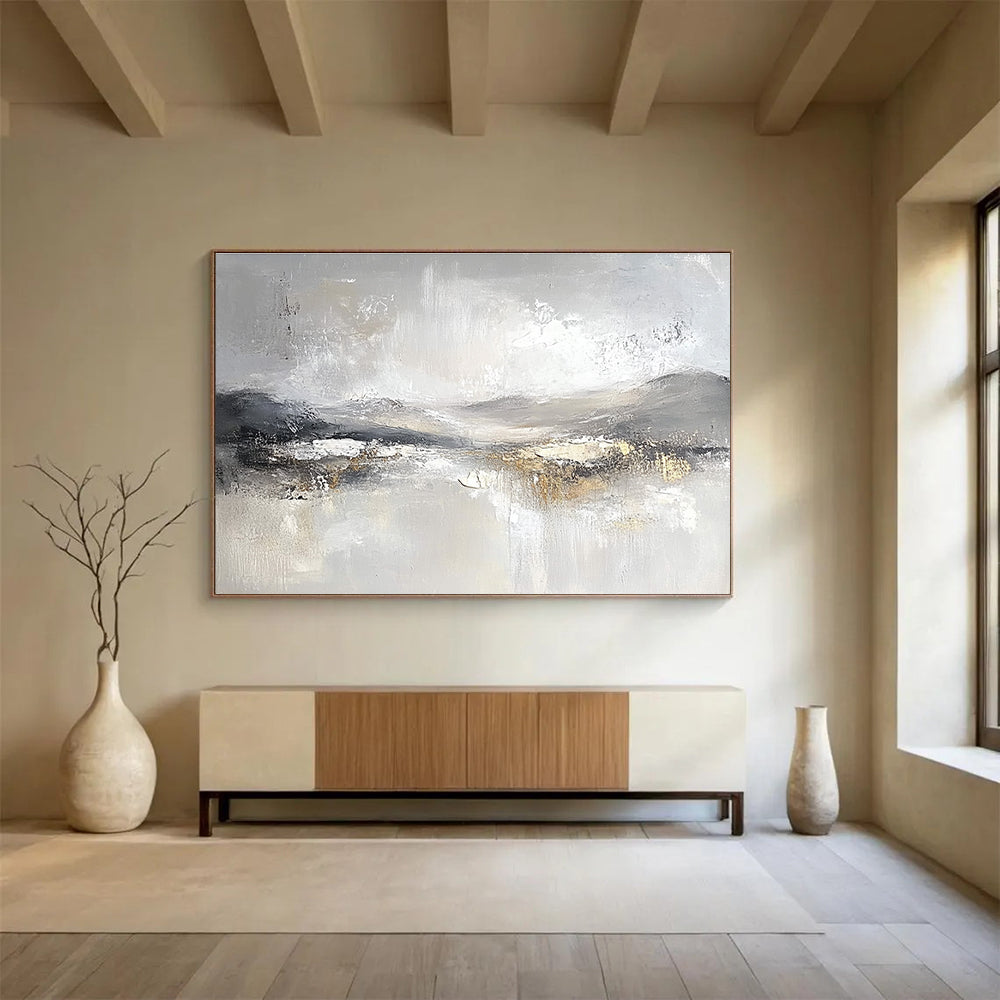 Large abstract painting featuring soft gray and white tones with subtle textures of snow-covered hills and ethereal clouds for a calming atmosphere.SC083