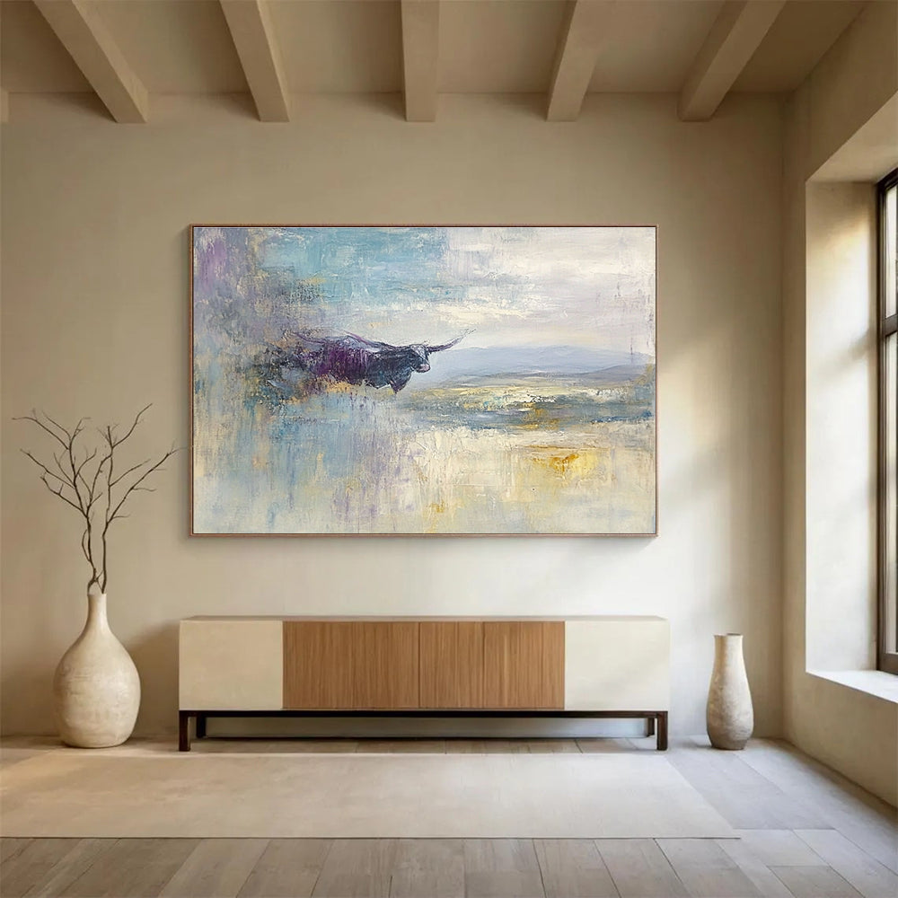 Large abstract painting depicting a flying cow over the English Lake District with a vast sky in shades of blue grey lavender cream and pale yellow.SC485