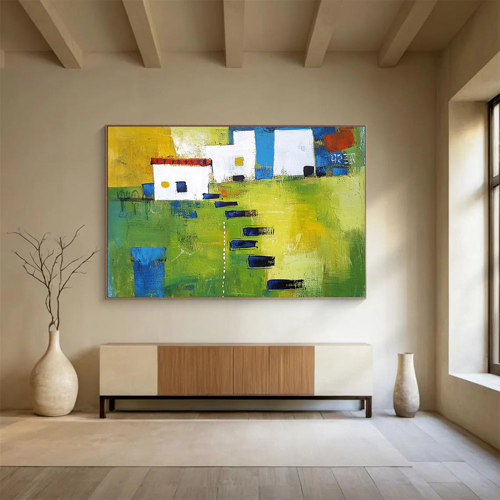 Large abstract painting showcasing green fields, white buildings with blue lines, and black stairs, featuring thick brush strokes and vibrant geometric shapes.SC193