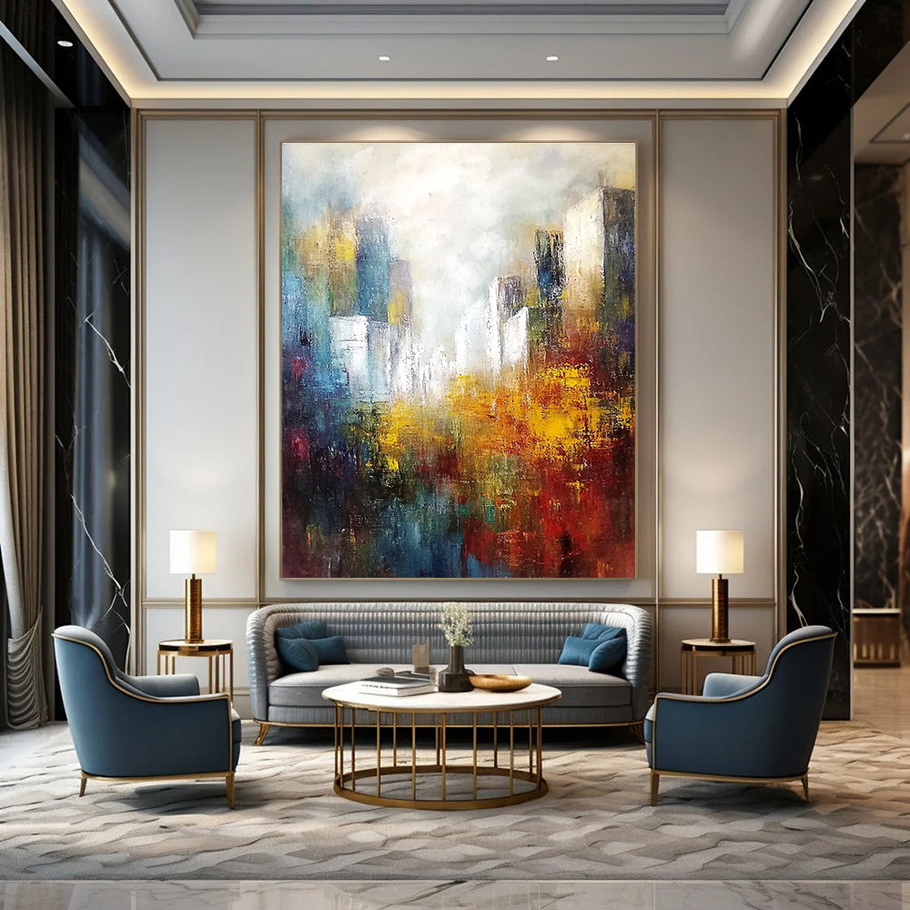 Large abstract landscape painting featuring white buildings in the distance with soft edges and muted tones in a light sky blue and dark amber palette.STSC106