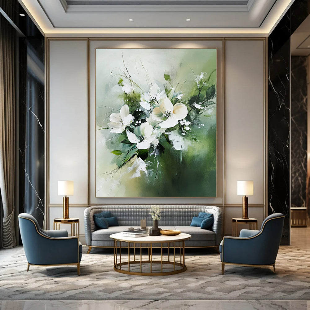 Large abstract painting featuring white flowers and green leaves in neutral tones against a soft green blurry background.STSC365
