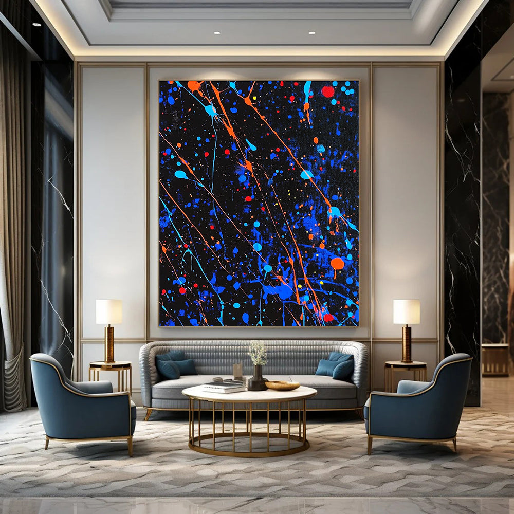 Large abstract painting featuring blue and black splatters with vibrant orange and red highlights for a dynamic artistic statement.STSC1406