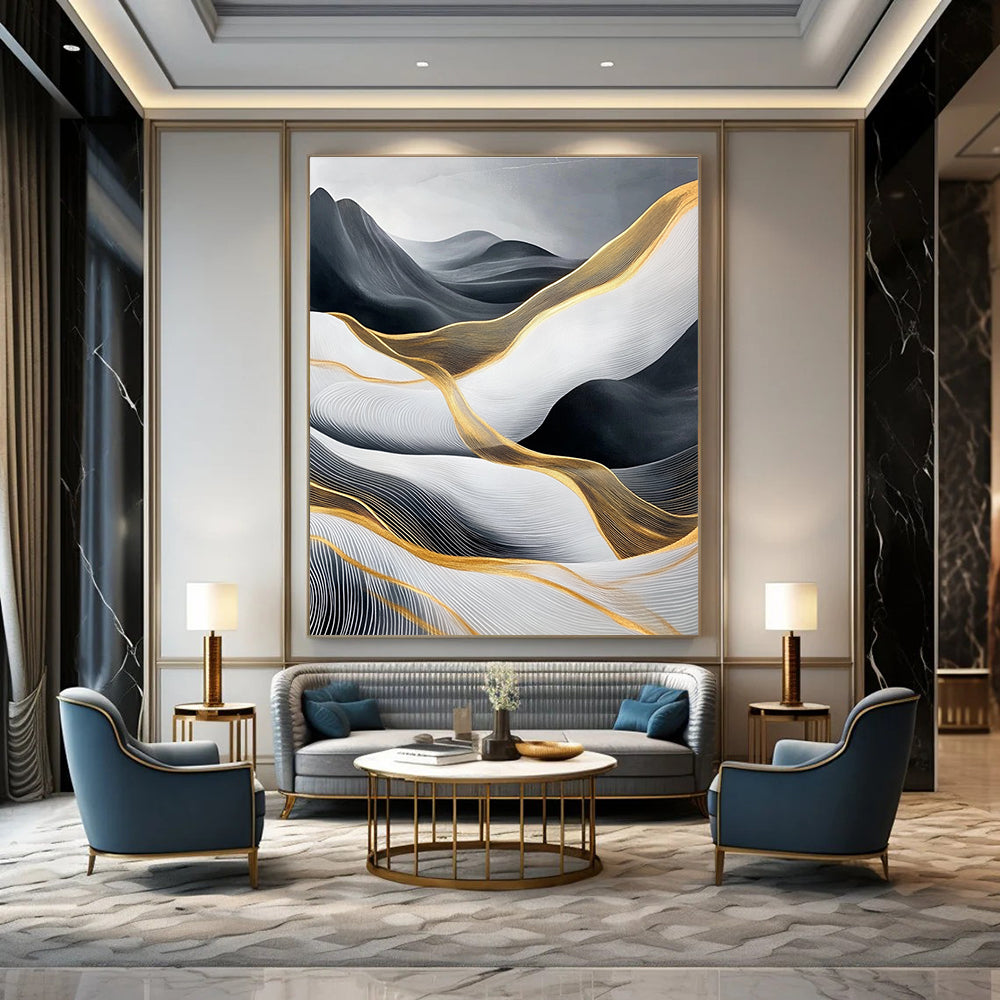 Large abstract painting of flowing waves in light gray and black with gold accents and prominent white areas and mountains.STSC358