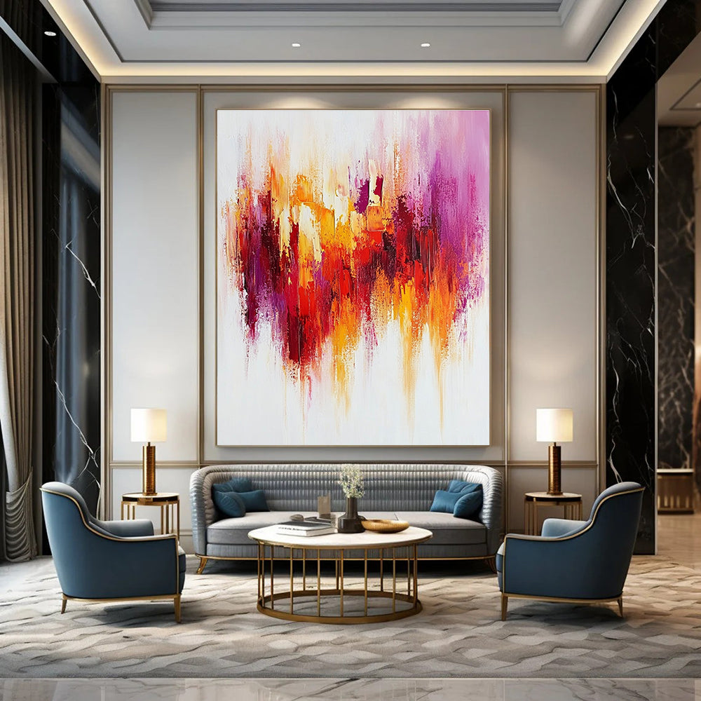 Large abstract painting with textured brush strokes in warm reds and yellows accented by purple on a white background creating a happy uplifting mood.STSC814