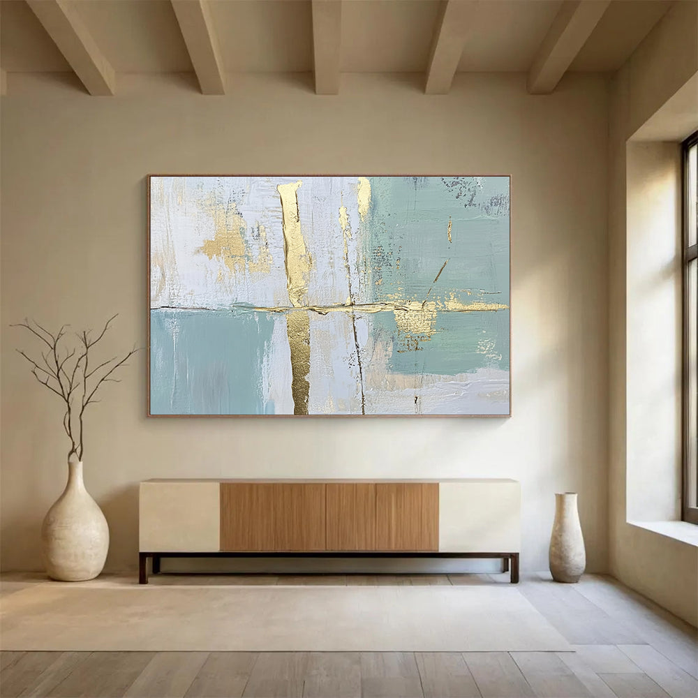 Large abstract painting with pale green and blue lines and shapes enhanced by gold foil accents for an elegant touch.SC326