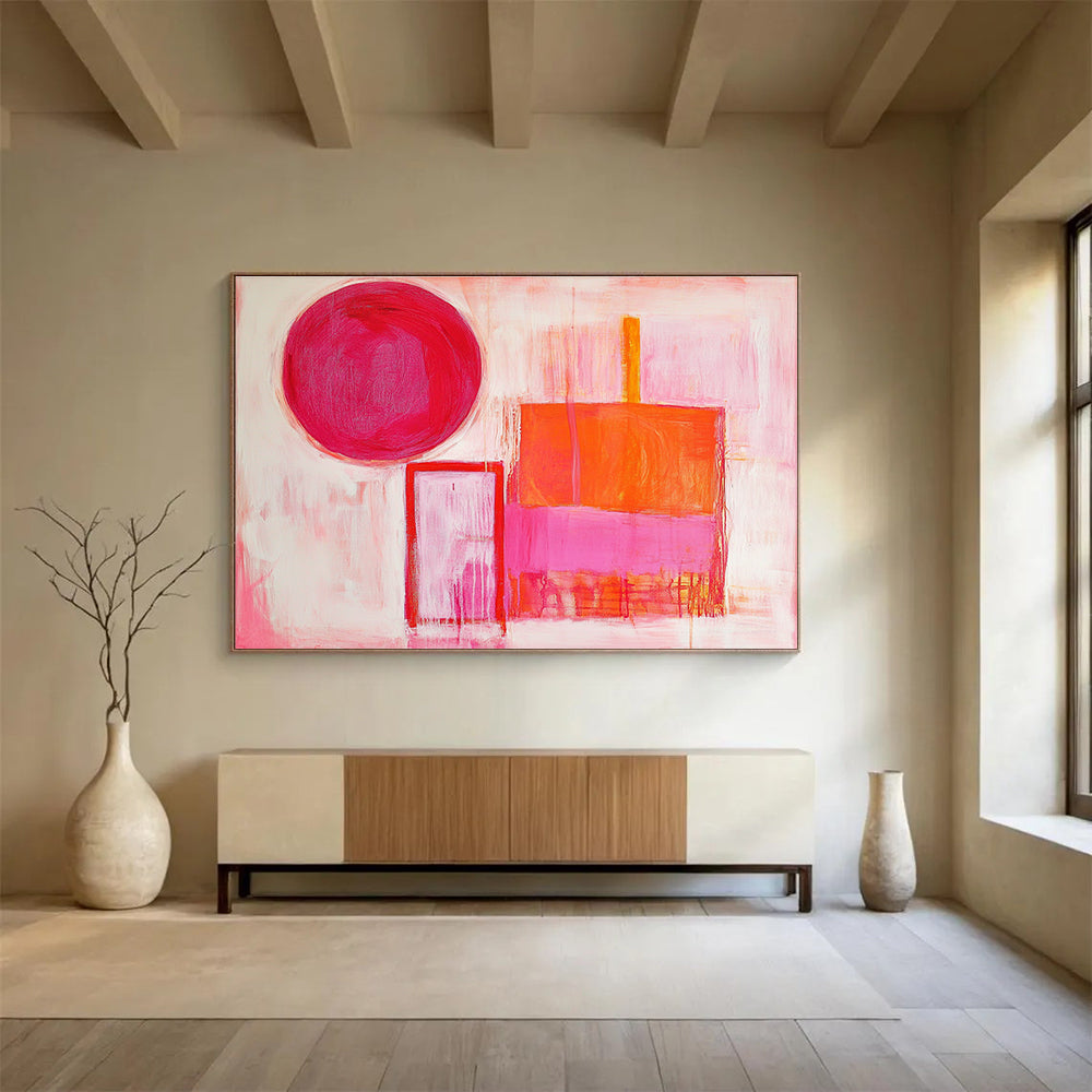 The large abstract painting features thick brush strokes with warm pink and orange hues, showcasing a circle, square, and rectangular shape.SC540