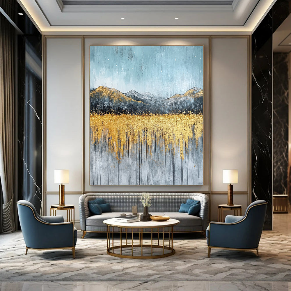 Large abstract painting with gold and silver on textured canvas featuring a serene sky golden mountains and soft gray grass.STSC097