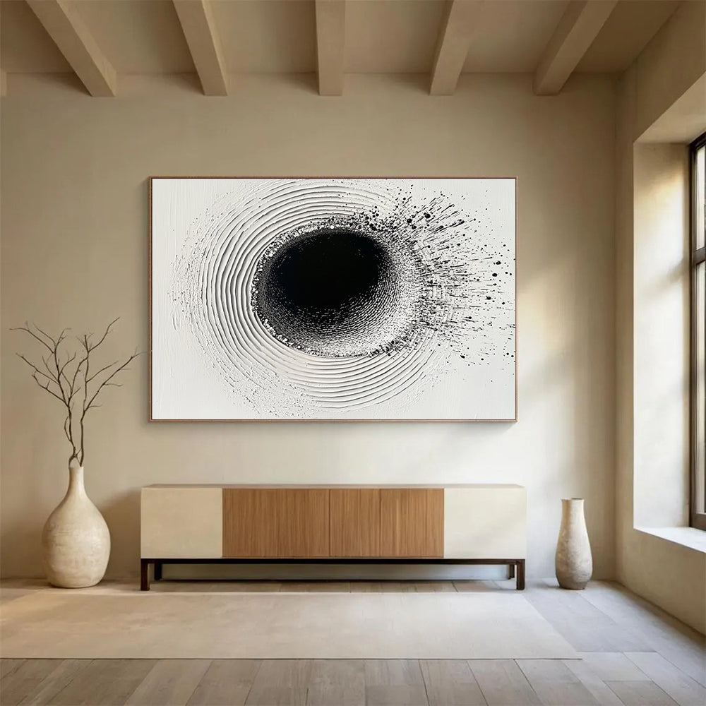 An abstract painting featuring a circular hole filled with water droplets creating ripples on a white plaster background with black ink lines.SC435
