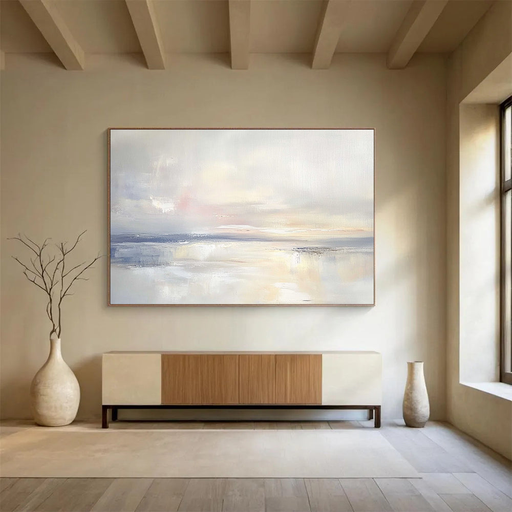 A large abstract painting featuring an open sky and gentle clouds in muted pastels, blending into serene waters for a tranquil ambiance.SC556