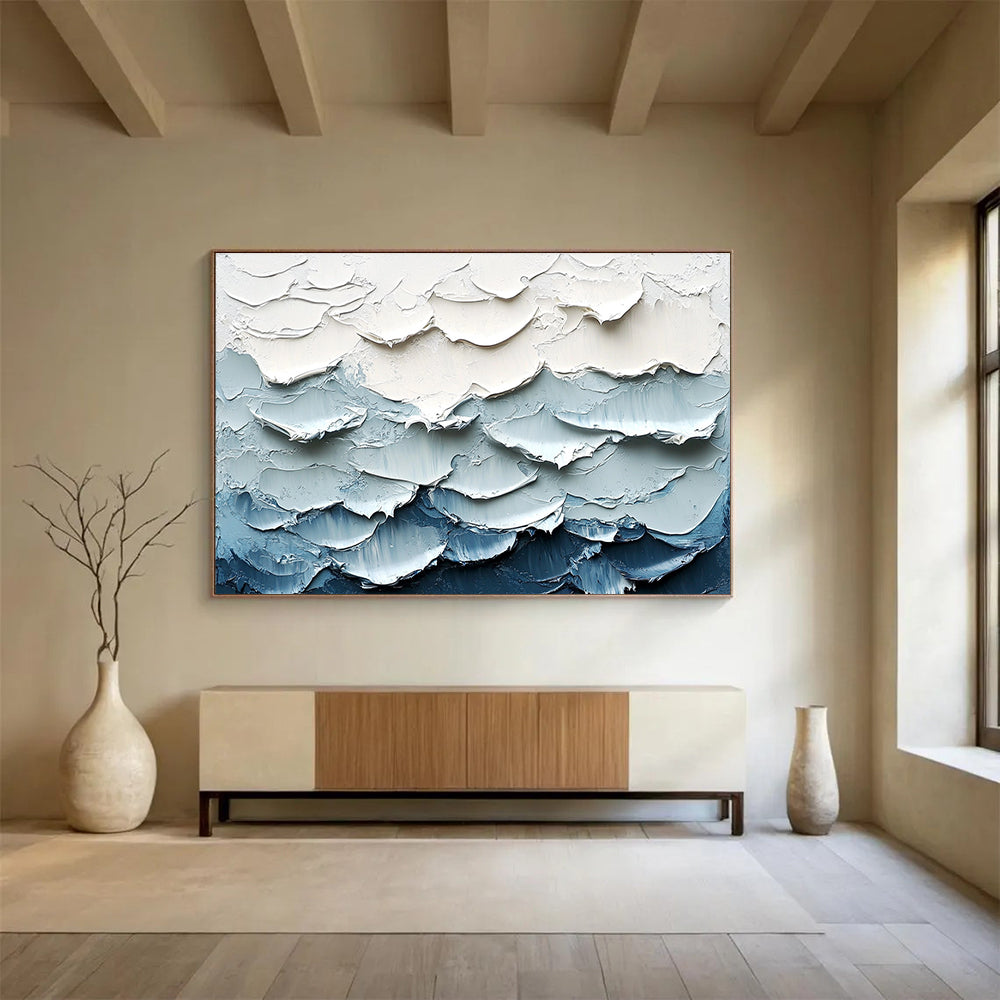 Large abstract painting of waves featuring a white and blue color palette with thick impasto texture for a striking visual effect.SC205