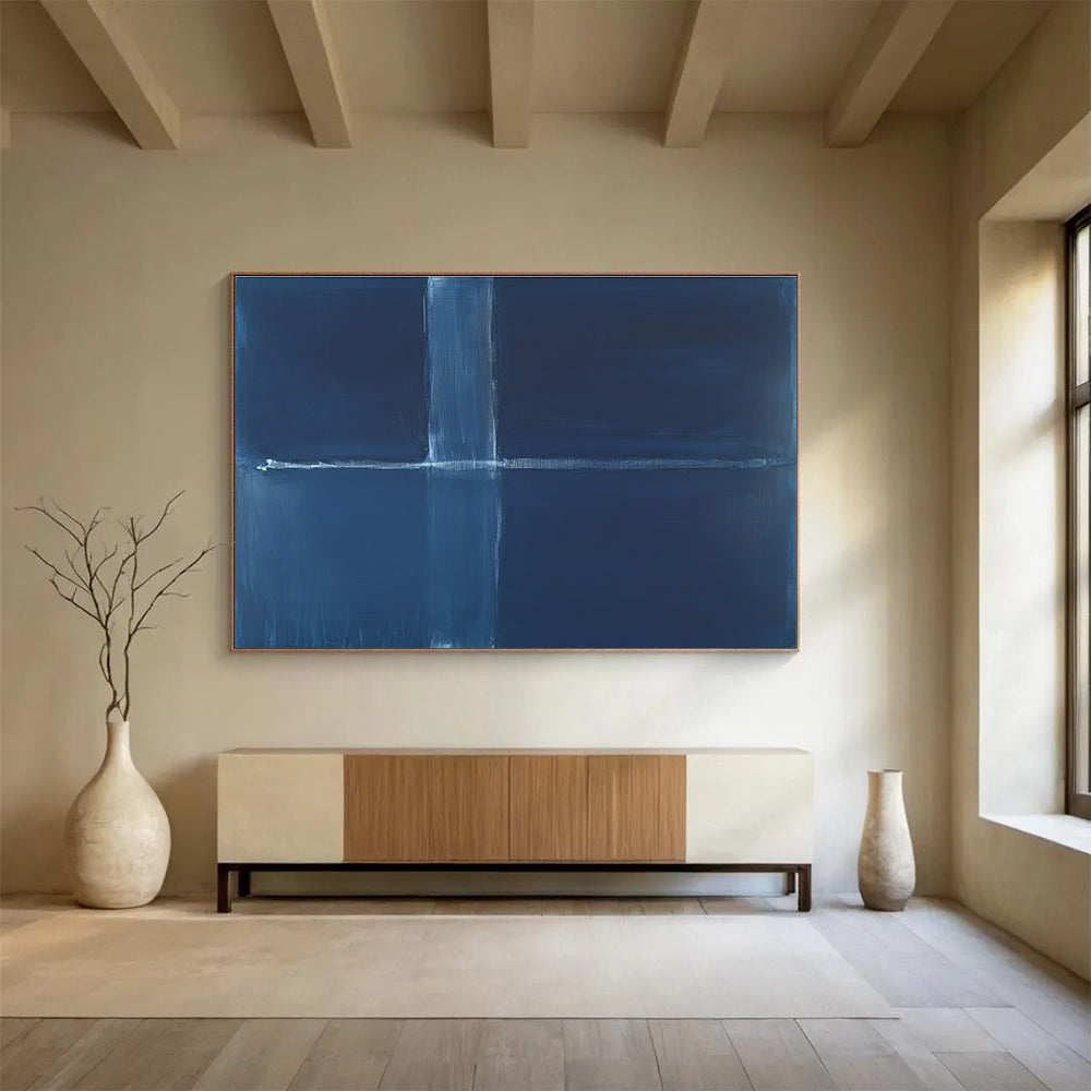 A large abstract painting featuring a deep blue background with a thin straight line and a thick wavy line in the center.SC515
