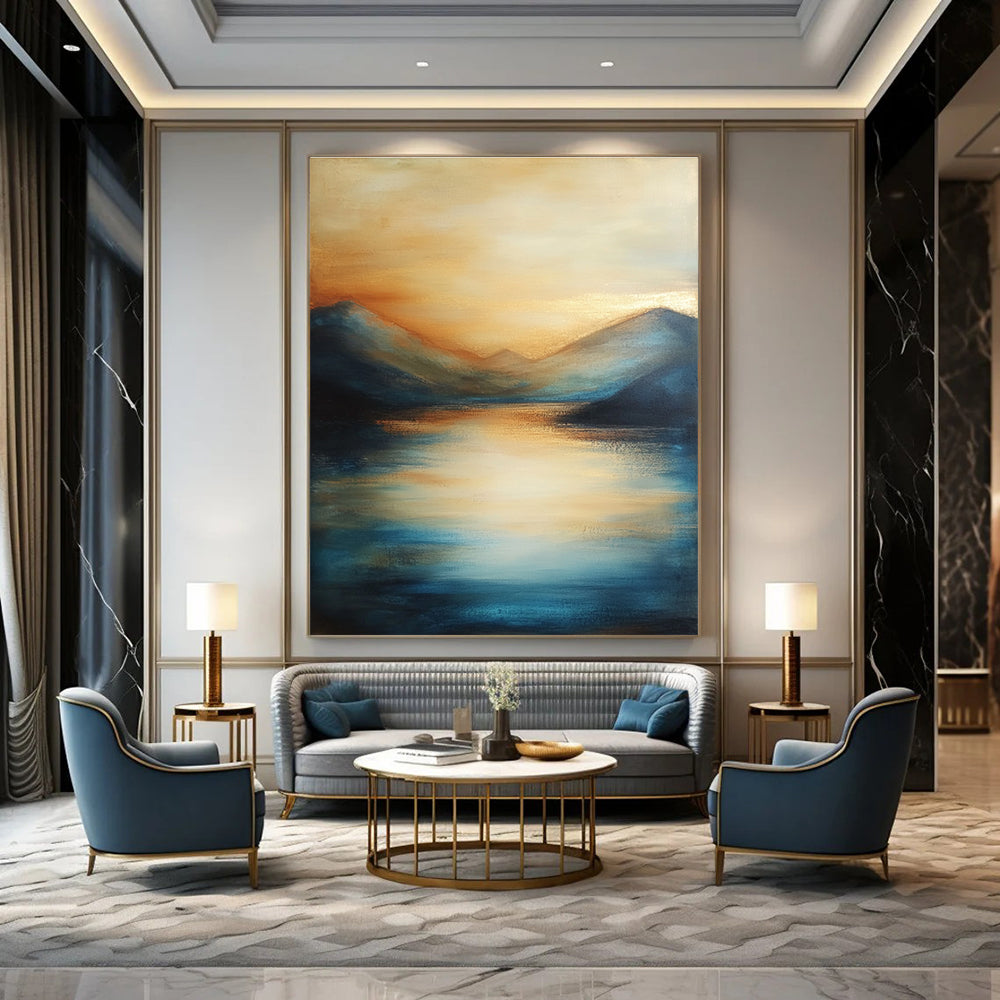 Large abstract painting of the sea featuring soft brush strokes with blue tones and golden accents creating a serene sunset atmosphere.STSC092