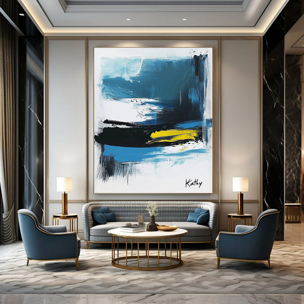 Large abstract painting of the sea featuring blue black and white brush strokes with yellow accents signed by Kathy.STSC1423