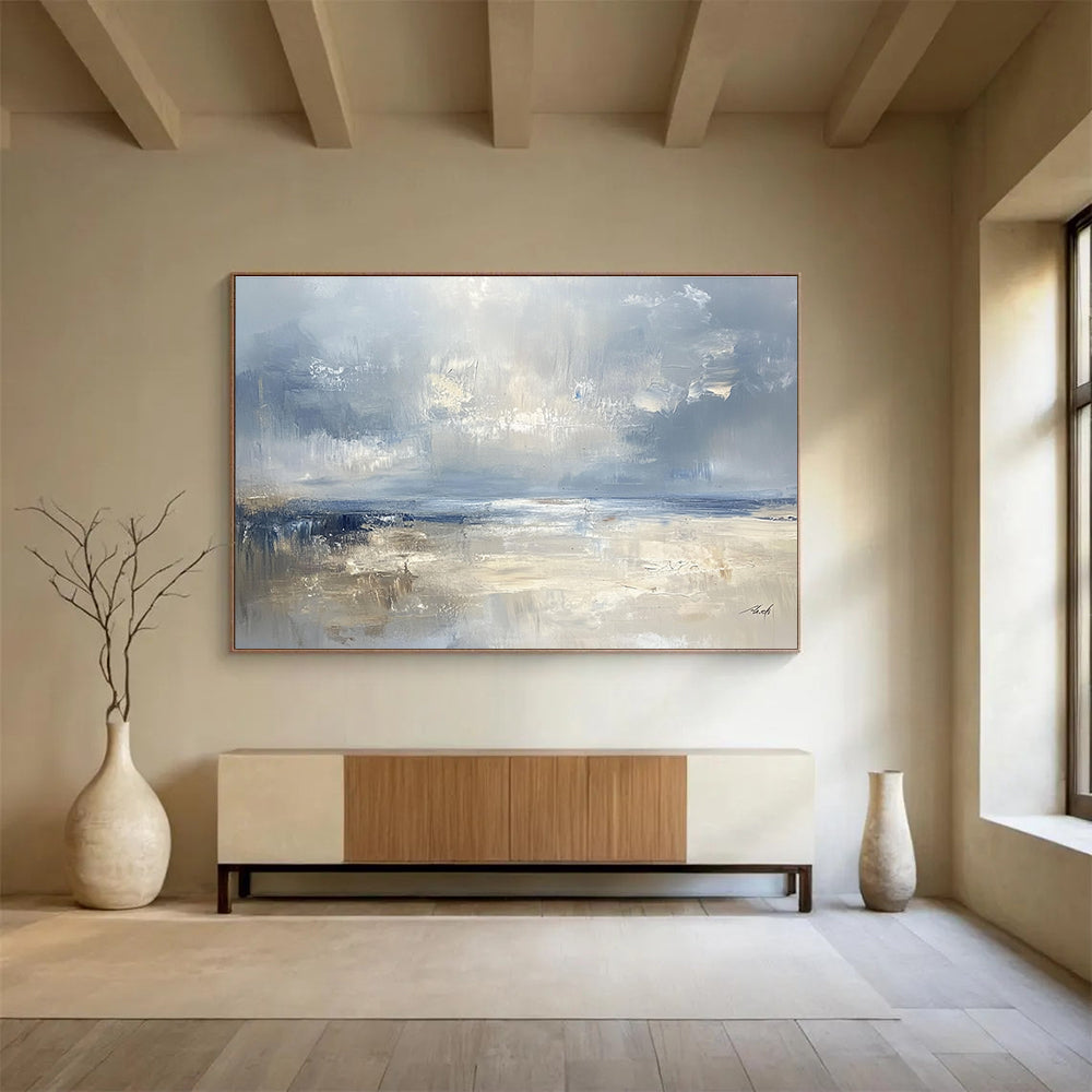 Large abstract seascape in cool blues and grays with warm beige accents capturing serene coastal beauty and a misty horizon.SC278