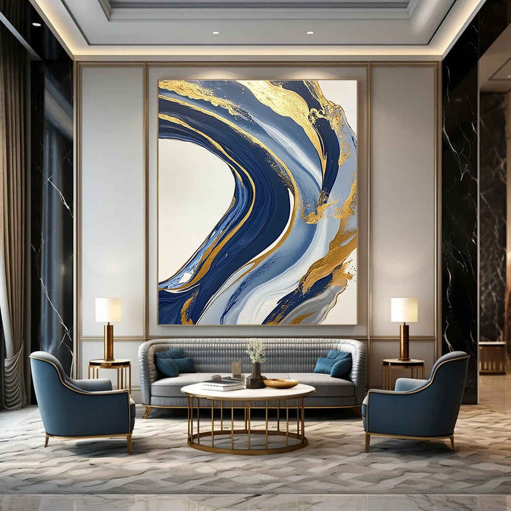 Large abstract blue and gold painting featuring marbling on a white background with swirling gold lines and fluid shapes creating luxurious textures.STSC032