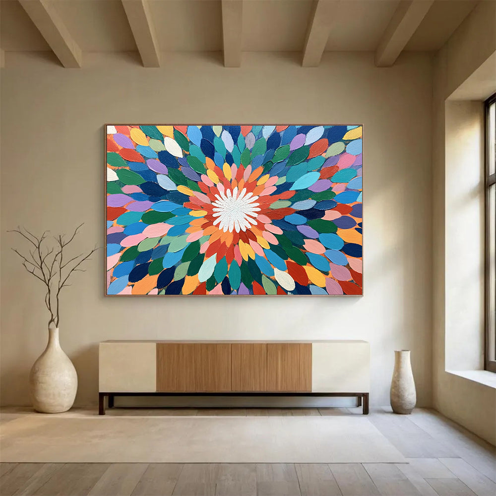 A large abstract painting featuring colorful overlapping petals in shades of green, blue, pink, orange, yellow, and purple with a vibrant center.SC526