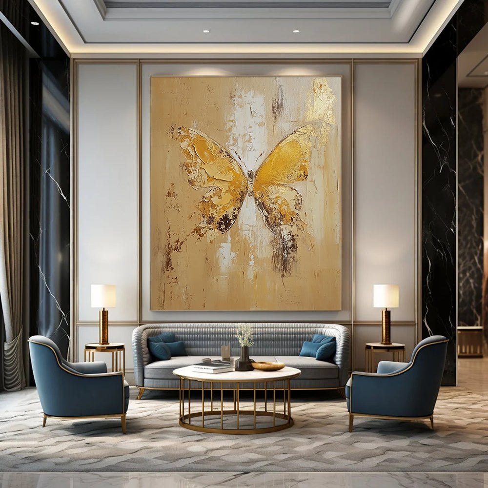 Large abstract painting of a butterfly in light yellow and beige tones with gold leaf and textured oil on canvas.STSC252