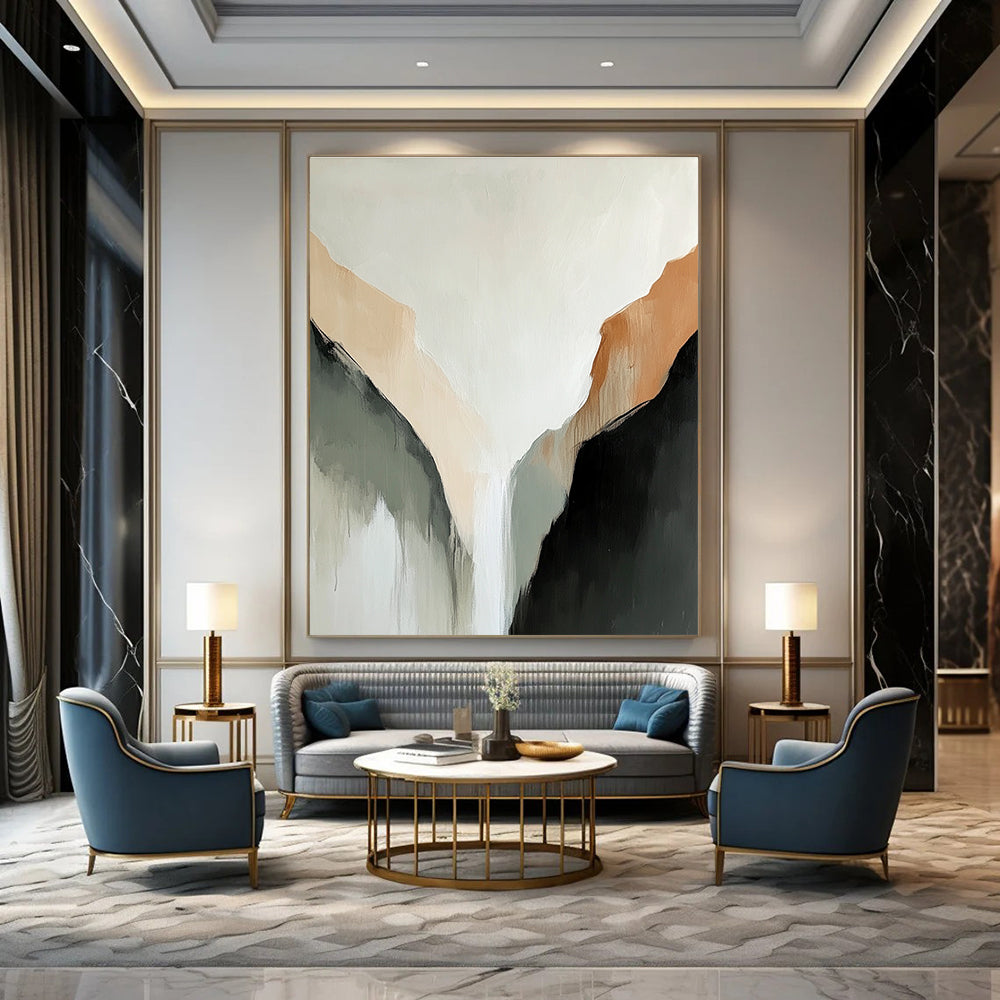 Large abstract painting of a tranquil mountain range in muted beige and black tones against a serene white background.STSC652