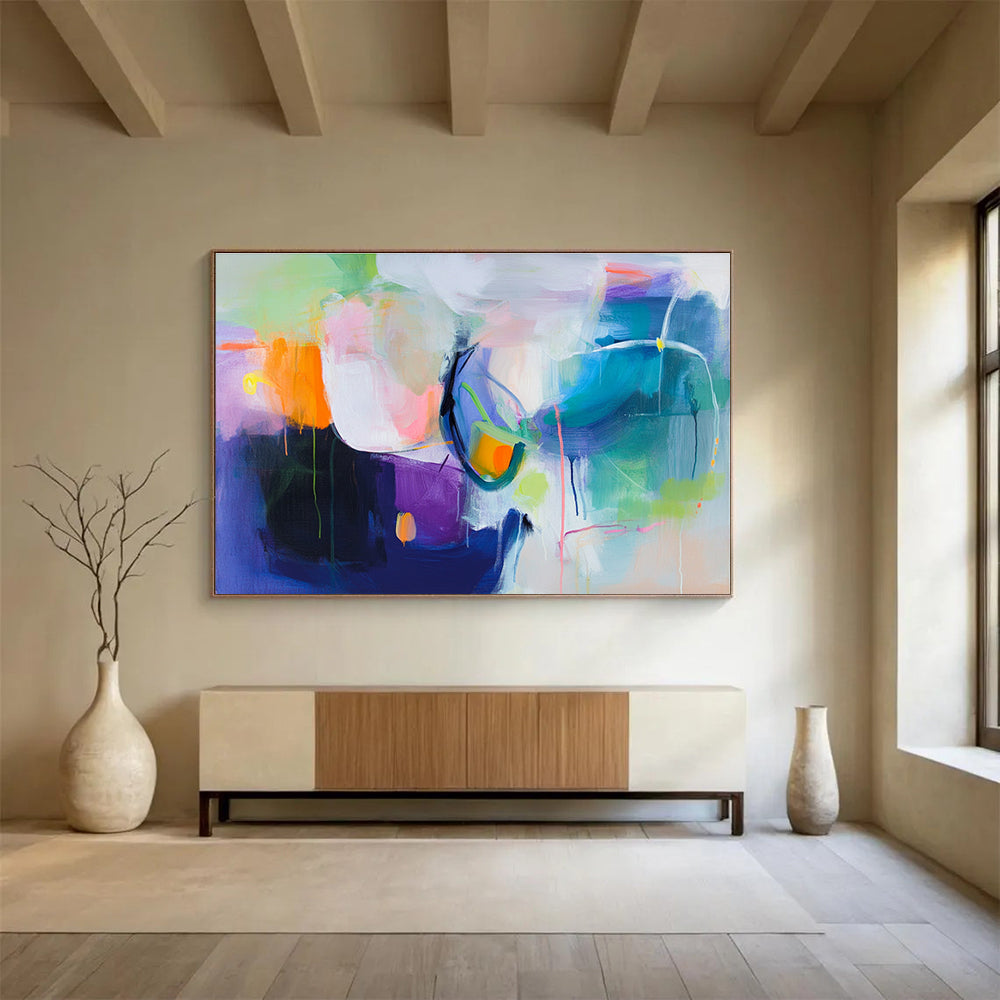 A large abstract painting featuring a colorful background with soft shapes and bold colors, evoking movement and energy with hints of pink blue green and more.SC312