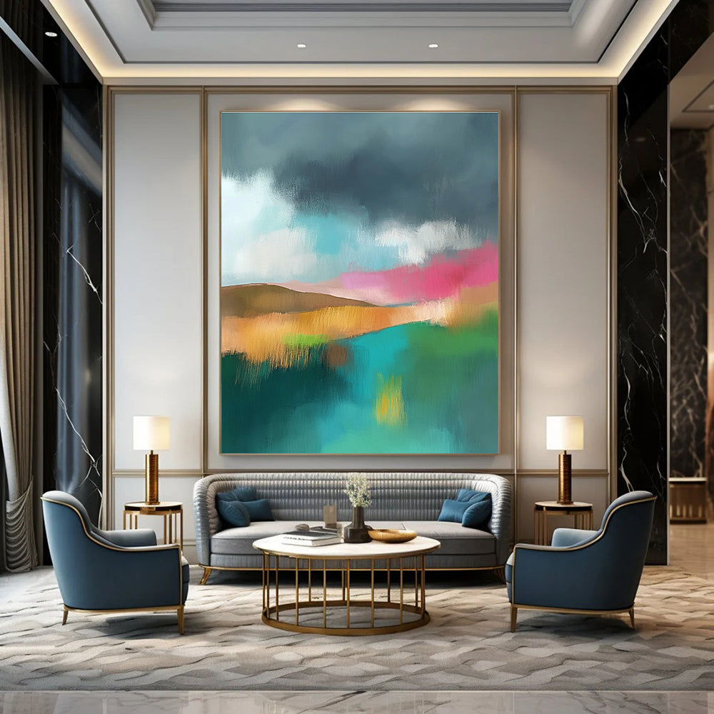 Large abstract painting featuring light teal and pink hues with a green field brown hills and a dark grey sky adorned with white clouds.STSC087