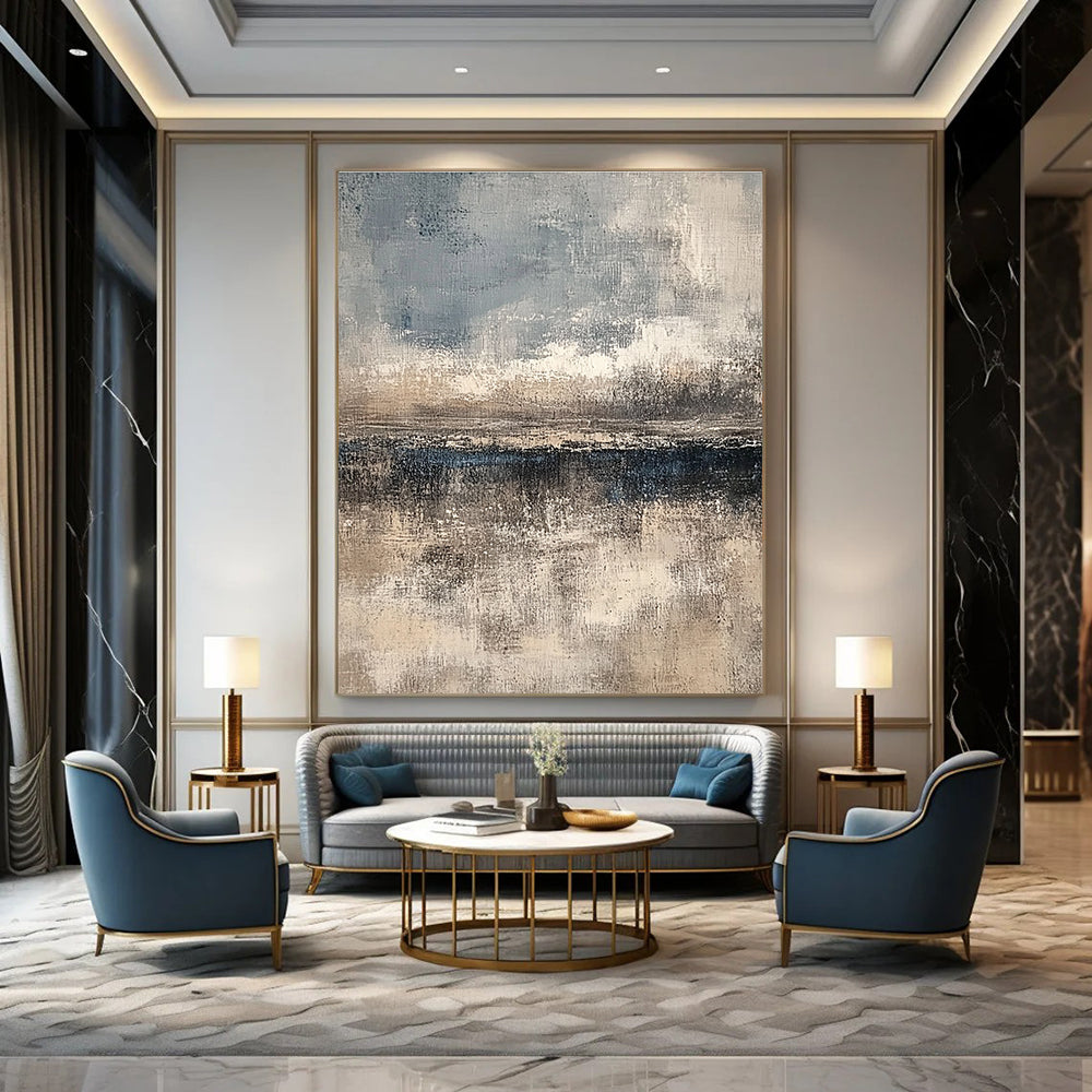 Large abstract painting featuring textured layers in neutral beige and gray with subtle blue and white accents creating depth and a serene horizon line.STSC108