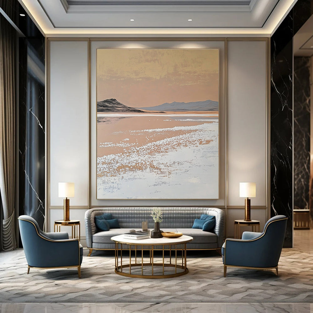 A large abstract painting features white salt crystals on a lake contrasting with textured brushstrokes in light beige and dark gold against a minimalist landscape.STSC1435