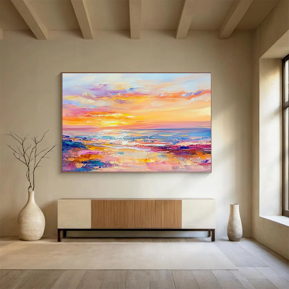 A large abstract painting of the sea at sunset in pastel colors with soft brushstrokes evokes calmness and tranquility.SC416