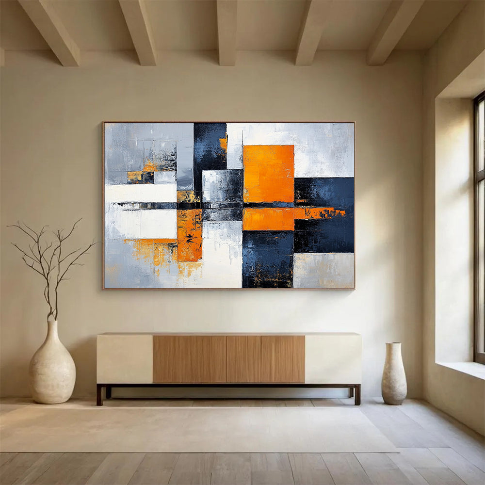 Large abstract painting featuring gray, white, and orange color blocks with a calming cityscape background, offering a sense of harmony and balance.SC100