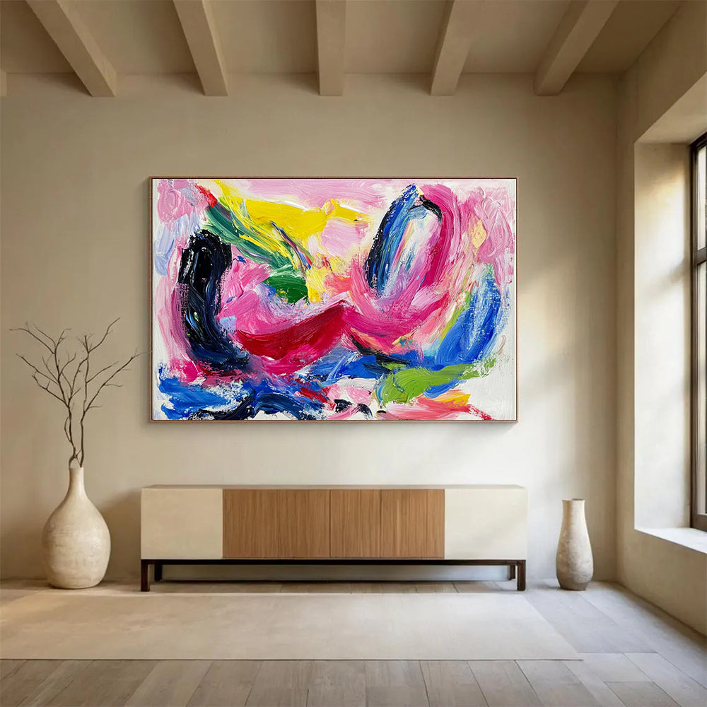 Large abstract painting featuring vibrant pink and blue hues thick brush strokes and dynamic black swirls with red lines and green shapes on a white backgroundSC150