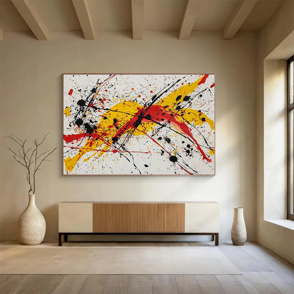 Large abstract painting featuring vibrant red yellow and black splashes evoking energy and freedom through dynamic brushstrokes and harmonious chaos.SC570