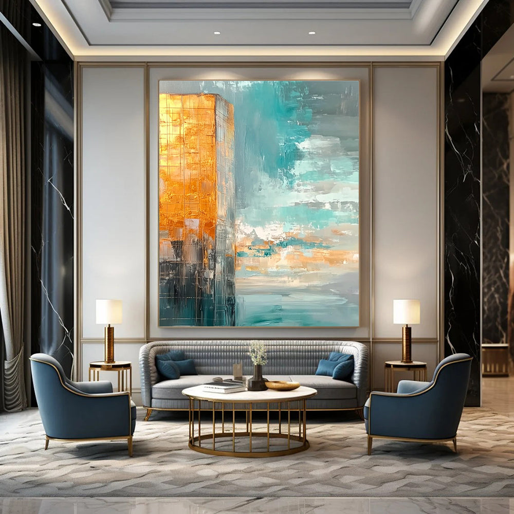 Large abstract painting featuring muted teal and gold tones with a vast sky clouds and calm water creating a serene atmosphere.STSC090