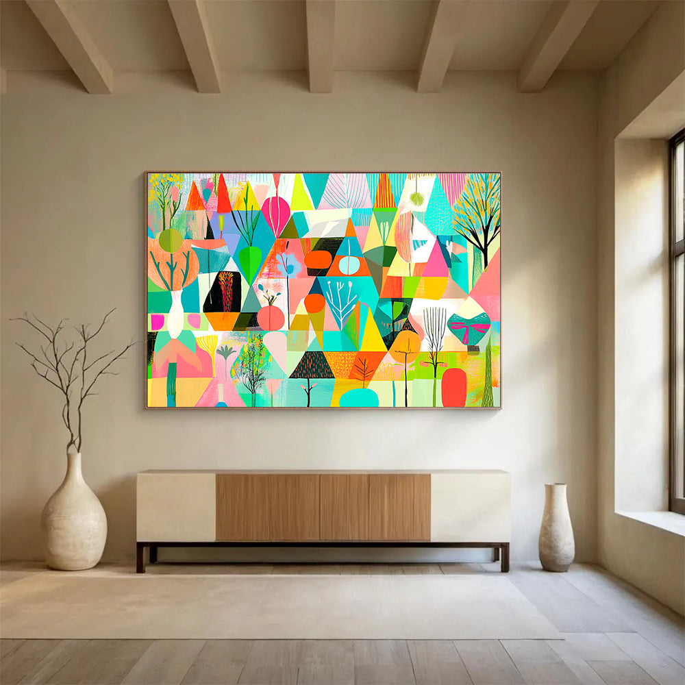 A large abstract painting featuring vibrant geometric shapes in shades of green pink blue yellow and orange with floral elements and nature motifs.SC563
