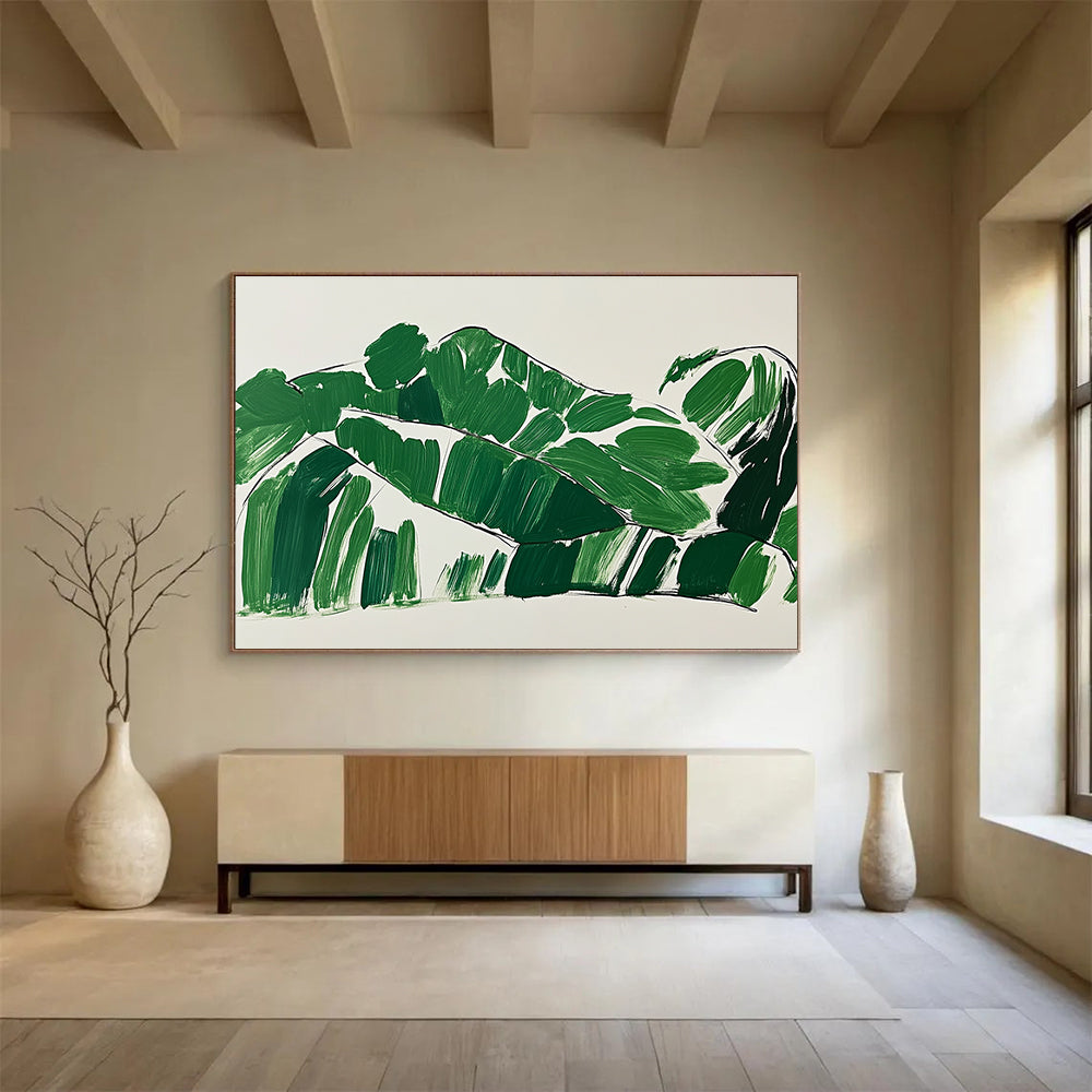 A large abstract painting featuring green leaves in the shape of a woman lounging on a couch with minimalist brush strokes on a white background.SC551