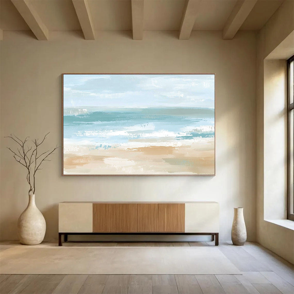 A large abstract painting depicting a serene coastal landscape in soft pastel colors, evoking tranquility with gentle waves and a sandy shore.SC545
