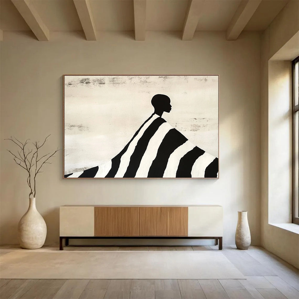 An abstract painting featuring a silhouette of an African man draped in a black and white striped blanket, evoking Tim Walker's artistic style.SC428