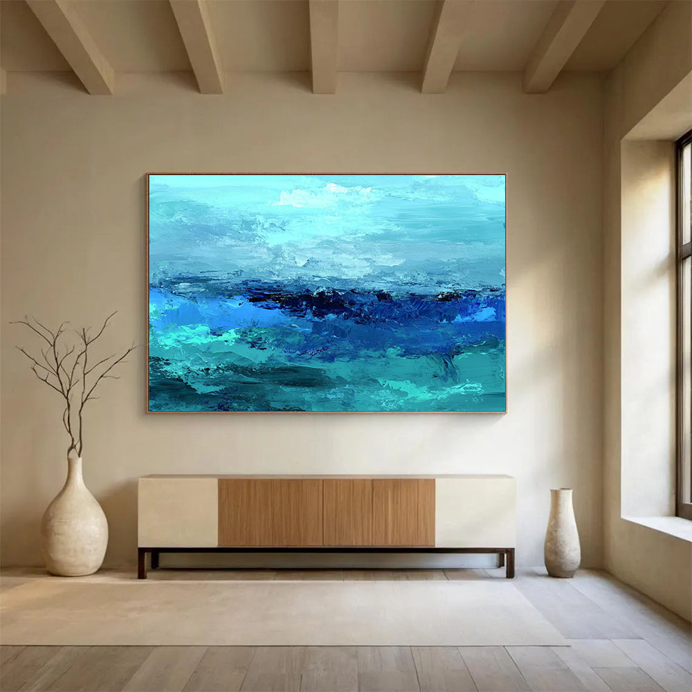Large abstract ocean artwork in shades of aqua teal and navy with textured layers suggesting waves evokes tranquility and depth on canvas.SC035