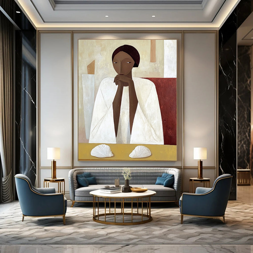 A large abstract painting featuring an African woman in a white cloak sitting on a yellow table with shells in daylight.STSC1115