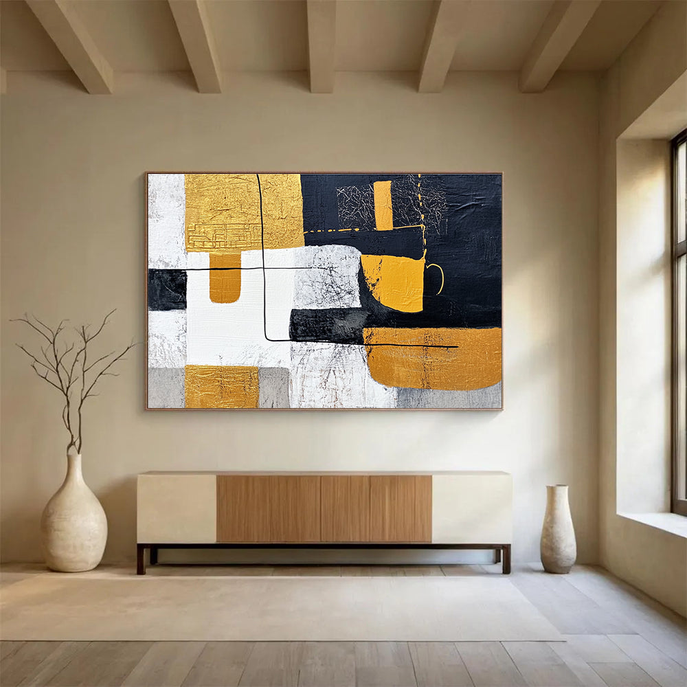Large abstract painting featuring white and yellow shapes with black lines on a dark gray background inspired by Chinese landscapes and embellished with gold leaf.SC266