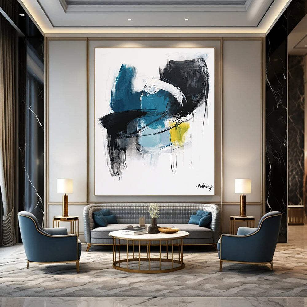 Large abstract painting in blue black and white tones with yellow accent by Anthony evoking calmness and serenity through soft brush strokes and thick lines.STSC1068