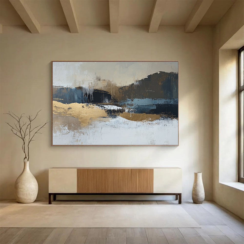 Large abstract painting in beige and dark blue tones with gold accents showcasing a minimalist winter landscape in a neutral color palette.SC226