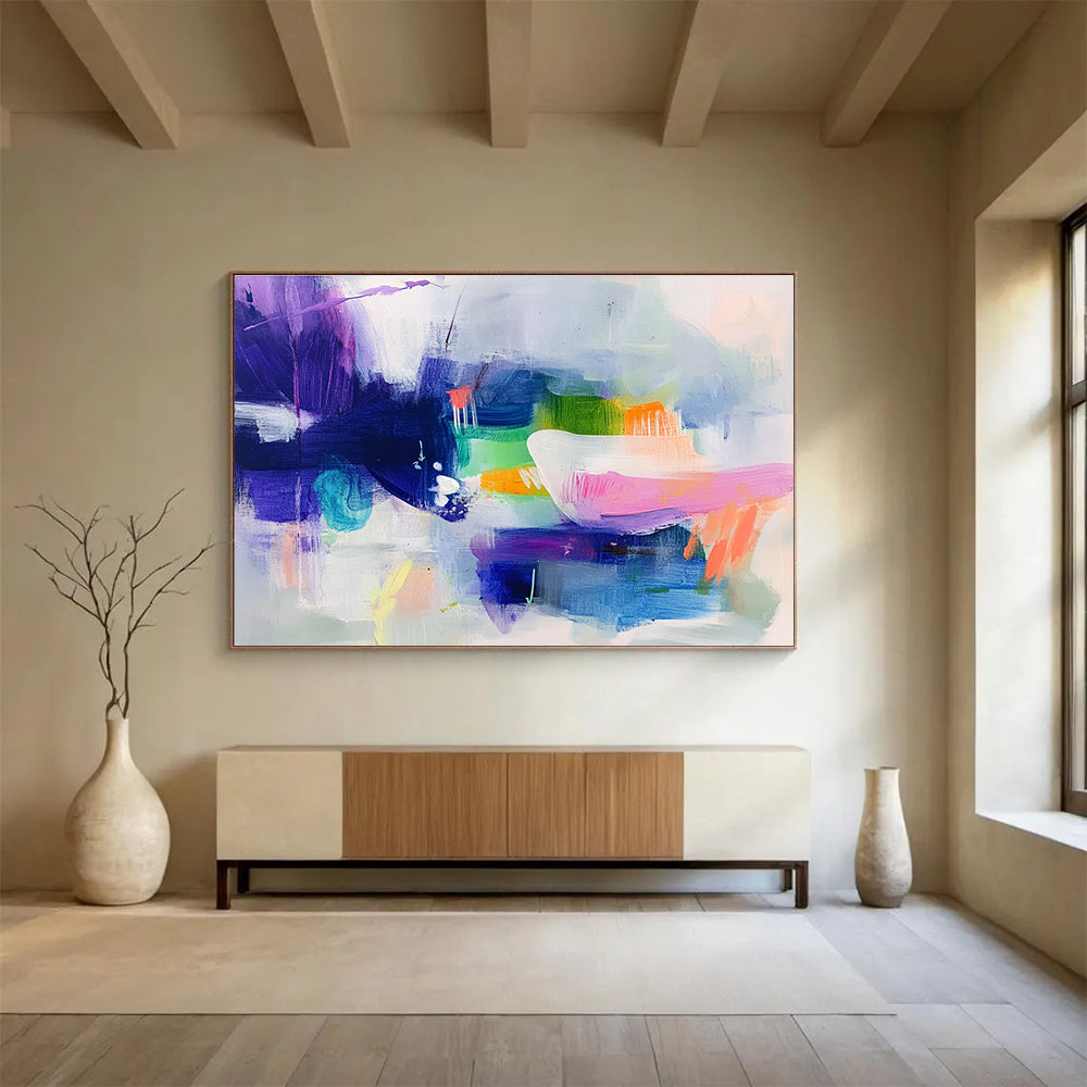 Large abstract painting featuring cool colors with soft shapes suggesting houses and flowing water creating a serene dreamy atmosphere.SC342
