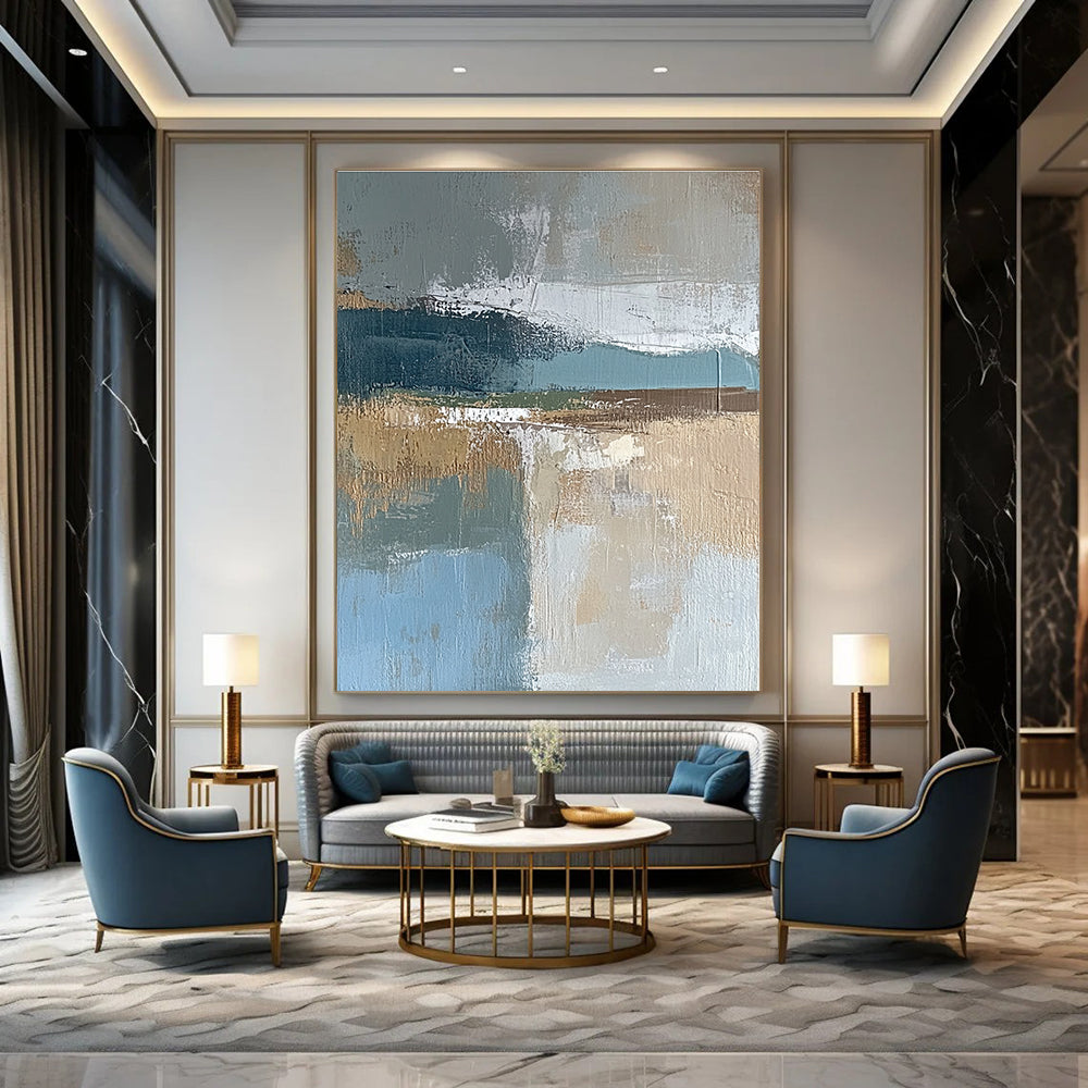 Large abstract painting featuring muted blue gray and brown tones with textured brushstrokes and earthy accents in green and beige.STSC563