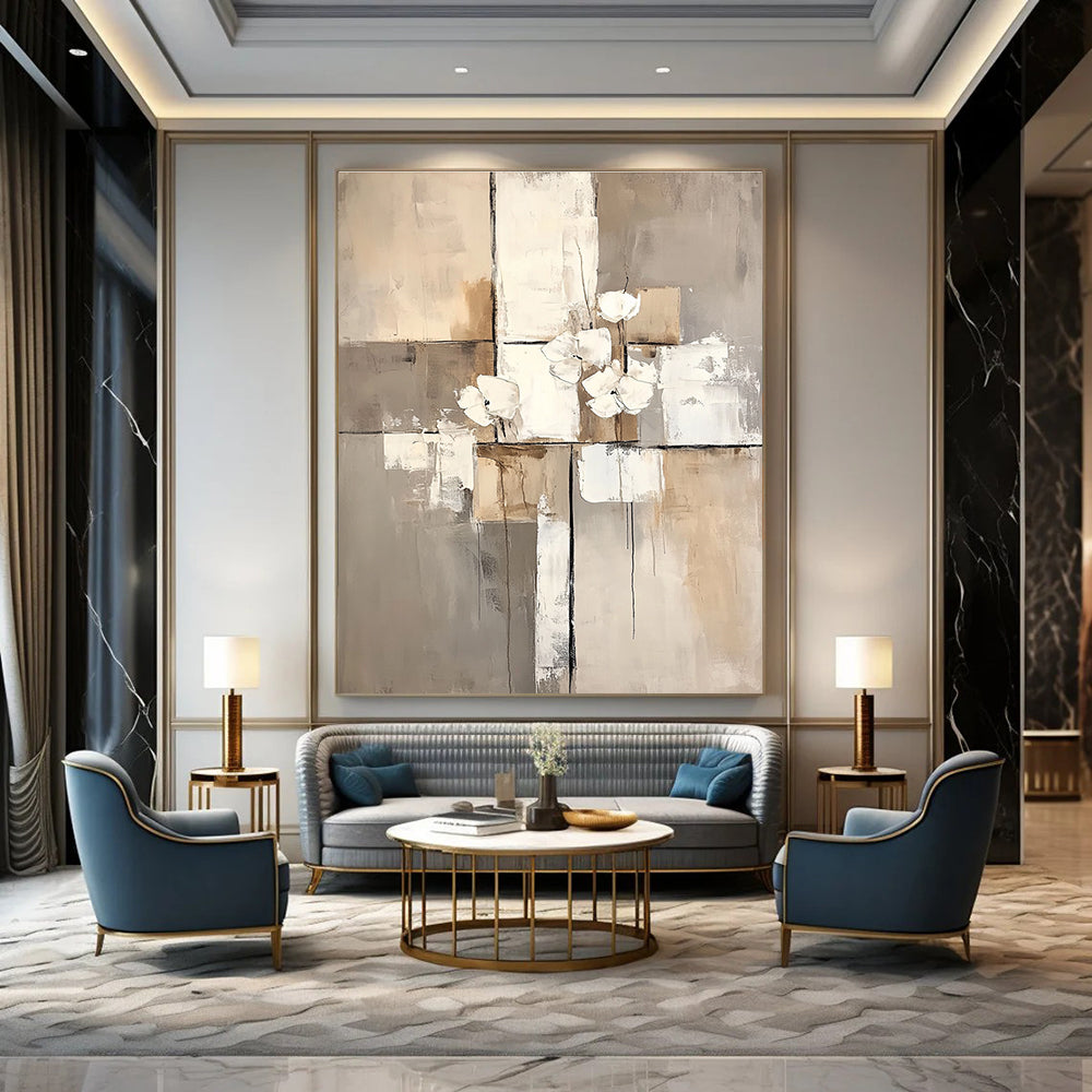 Large abstract painting featuring white paint blocks with a beige and gray palette on a neutral beige background.STSC431