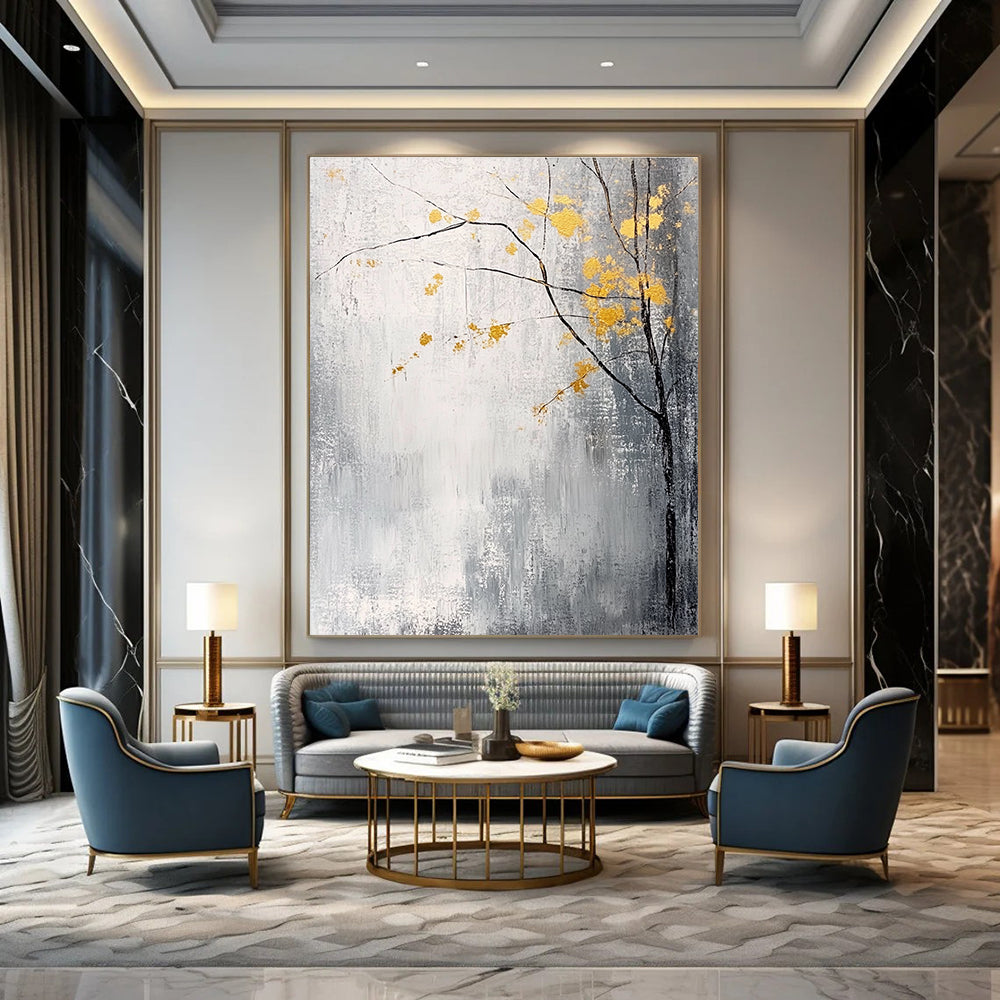 Large abstract painting with gray and white background yellow accents and delicate gold leaves creating a tranquil and mysterious atmosphere.STSC395
