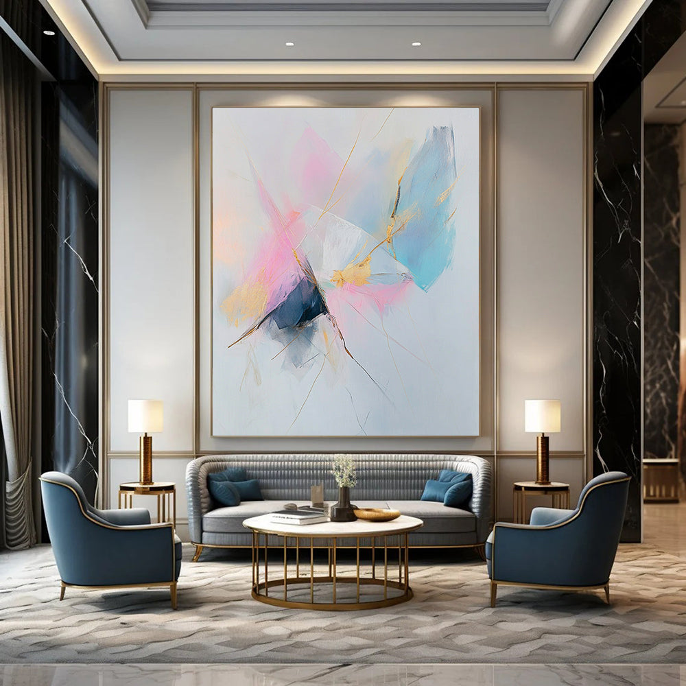 Large abstract painting featuring pastel pink and blue tones with gold accents on a white background creating a serene and calming atmosphere.STSC783
