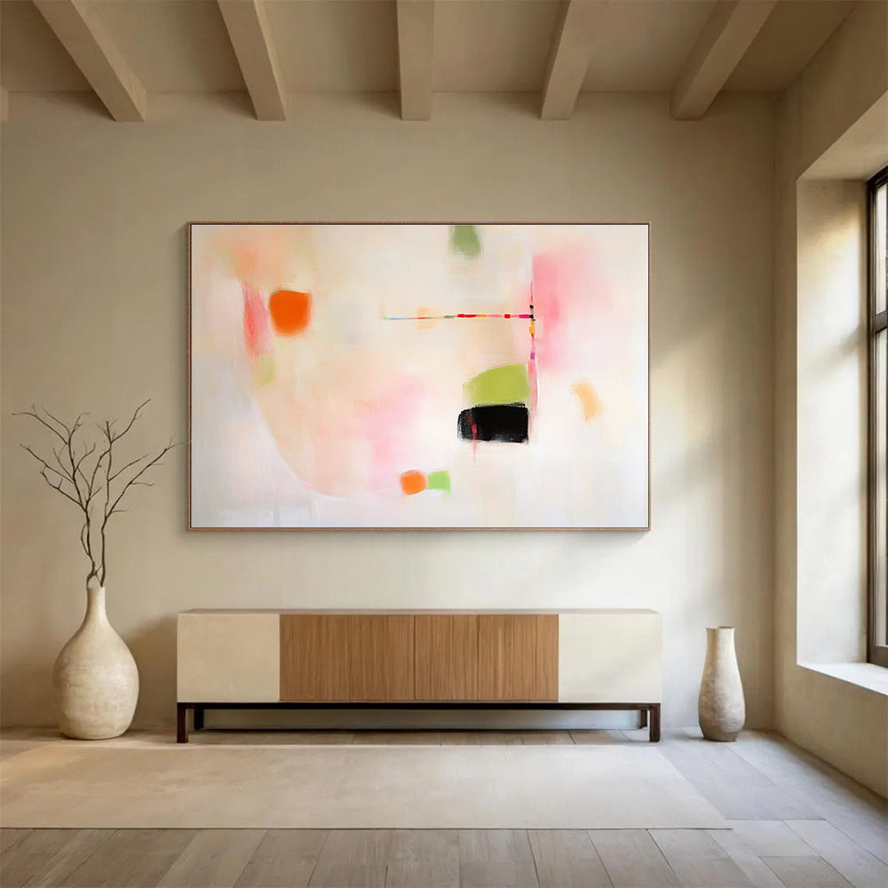 Large abstract painting featuring pink green and orange shapes on white background evoking calmness with gentle curves and contrasting black spaces.SC379