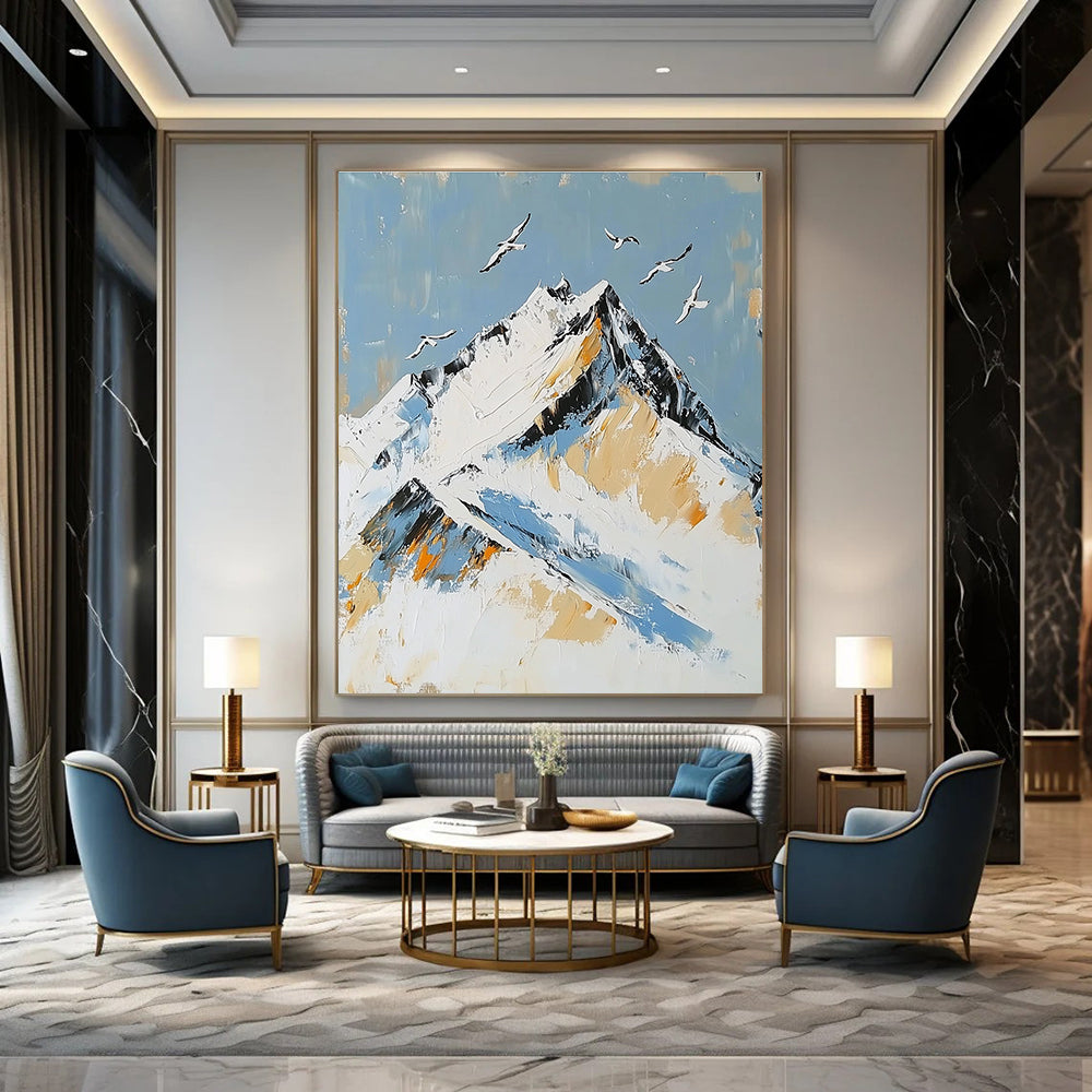 Large Abstract Painting featuring Snowy Mountain Peak with Birds in Flight accented with Gold in Elegant White and Blue Tones.STSC1365