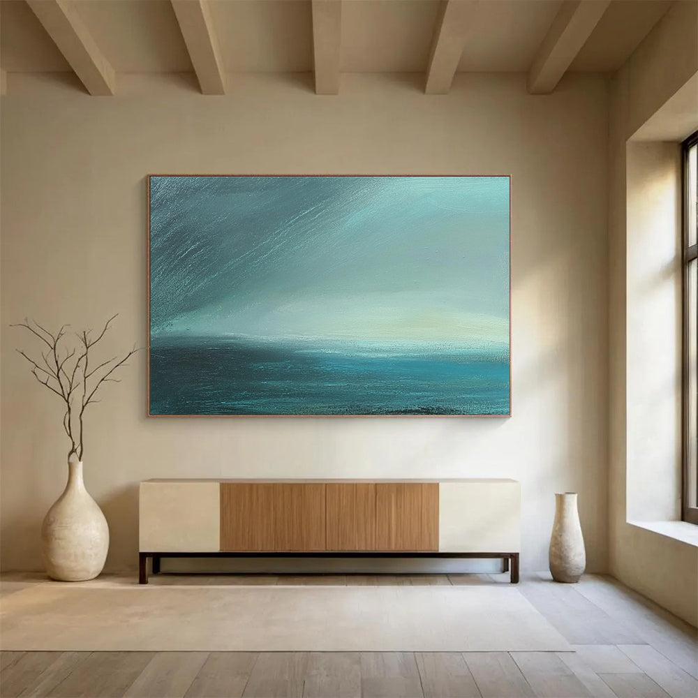 Large abstract painting in impasto technique featuring blue-green sea tones with fog and dark sky using thick, muted layers for atmospheric depth.SC497