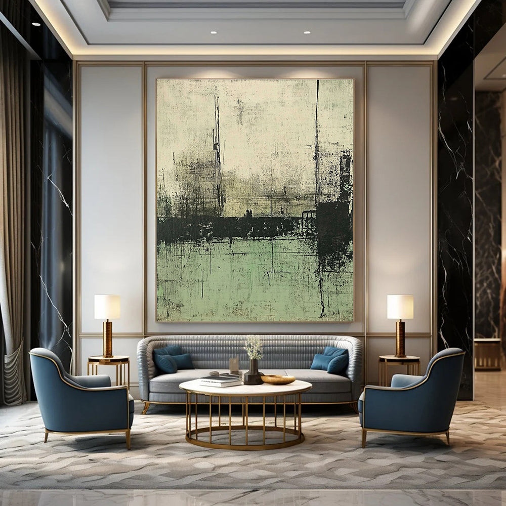 Large abstract painting featuring muted green and gray tones depicting a desolate landscape with distant buildings and water.STSC421