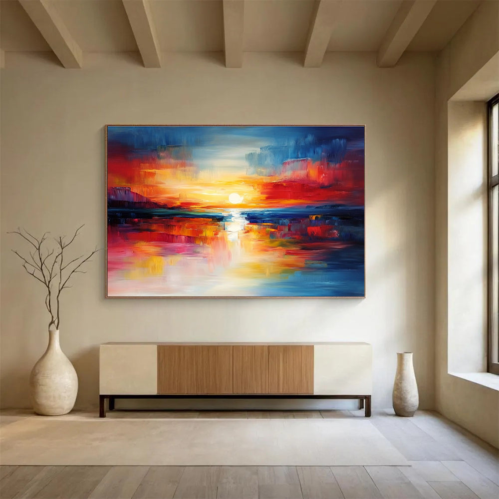 A large abstract painting capturing a vibrant sunset with blue and red hues reflecting on calm waters, creating a dynamic central composition.SC561